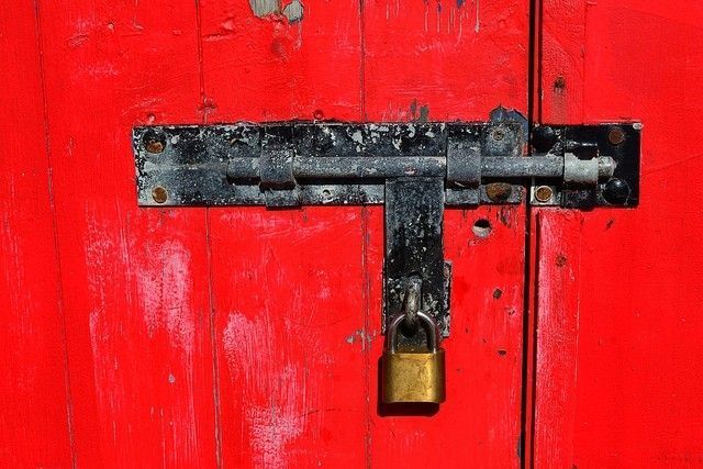 Red locked door ©Owen J Fitzpatrick